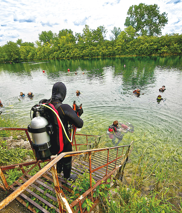 Quarry divers entering water