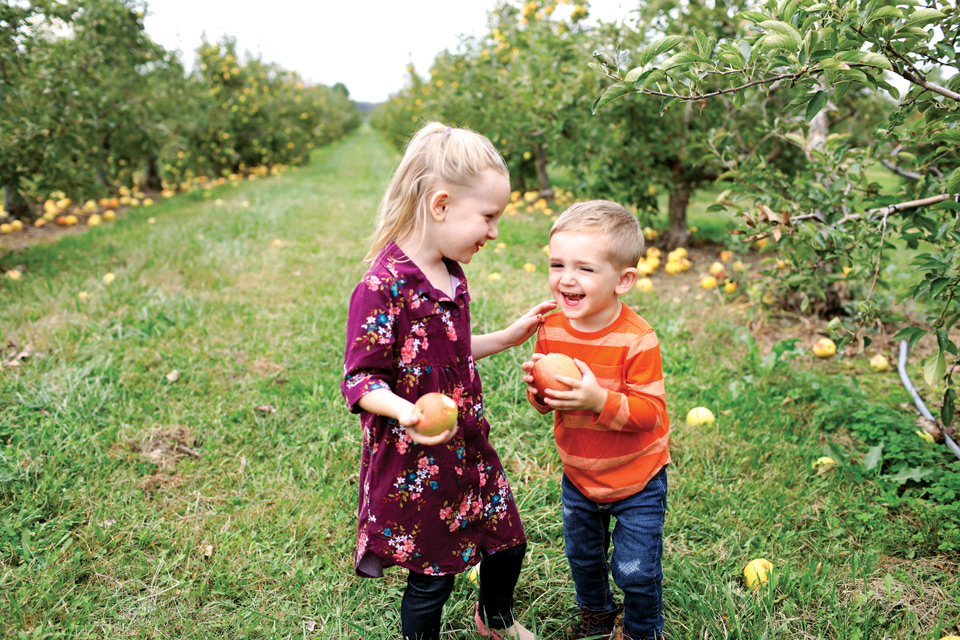 Little kids play in the orchard at Lynd Fruit Farm (photo courtesy of Lynd Fruit Farm)