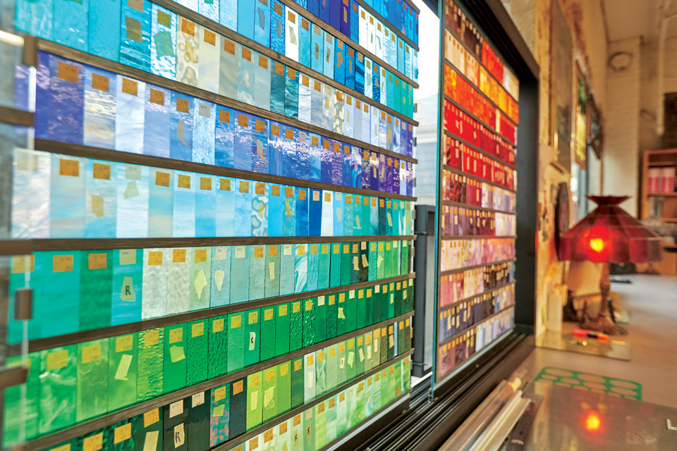 Various colors of stained glass at the Columbus workshop