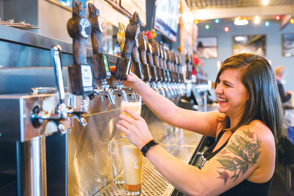 MadTree Brewing Co. server pours a beer