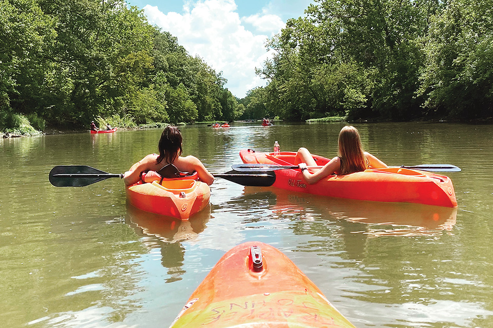 Two women in kayaks (photo by Madison Farley)