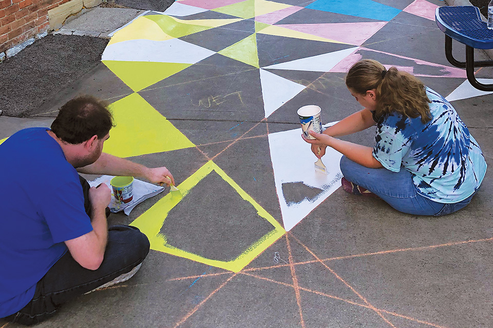 People painting InsideOut Studio mural (photo courtesy of Butler County Visitors Bureau)