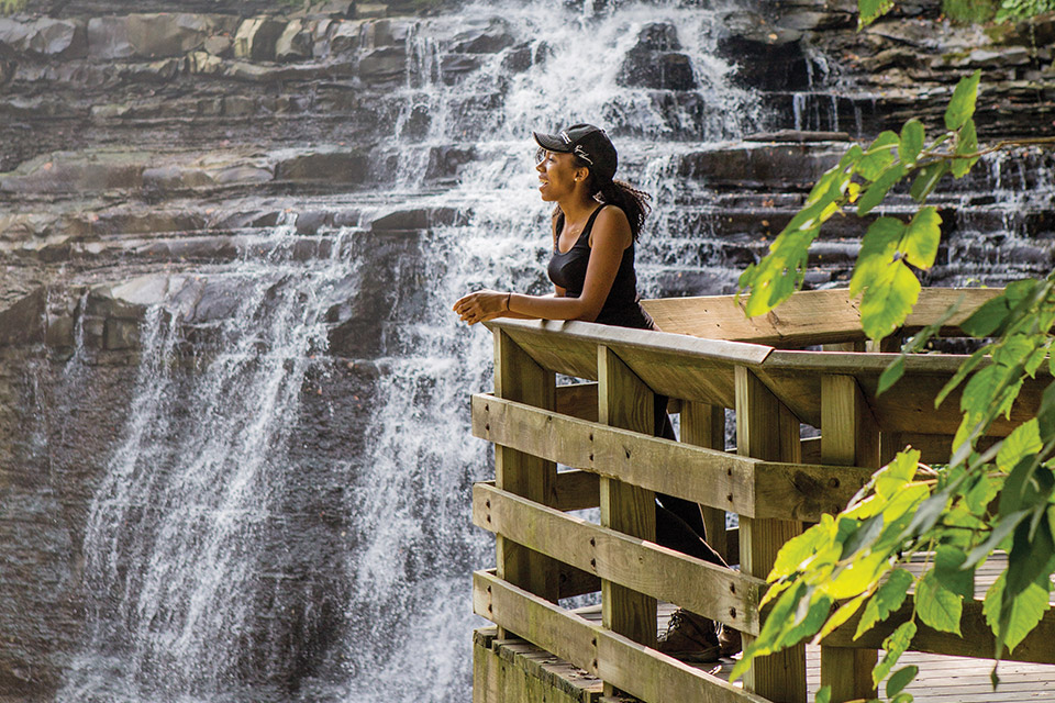 Woman looking at Brandywine Falls (photo by Laura Watilo Blake)