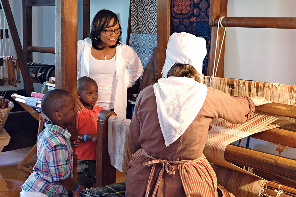 Family watching demonstration at Hale Farm & Village (photo by Nancy Balluck)