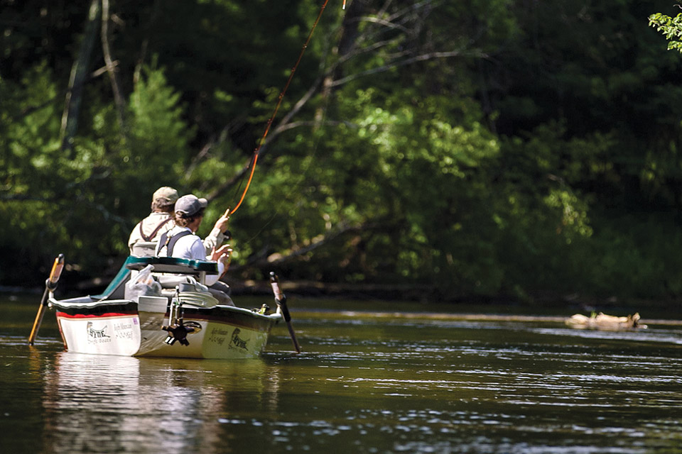 People fly fishing on the Pere Marquette (photo courtesy of Pure Ludington)