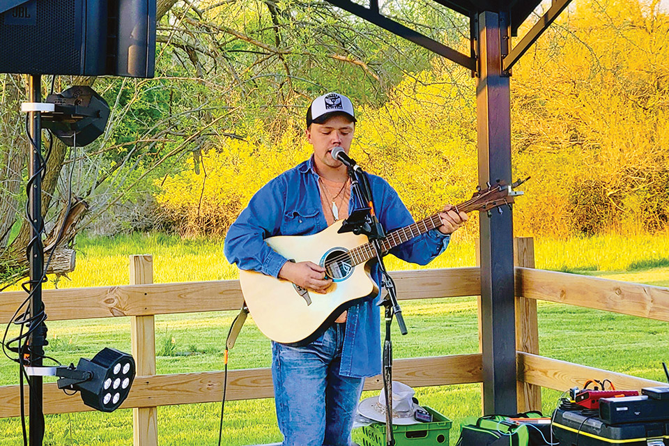 Musician performing at Twenty One Barrels Cidery and Winery (photo courtesy of Twenty One Barrels Cidery and Winery)