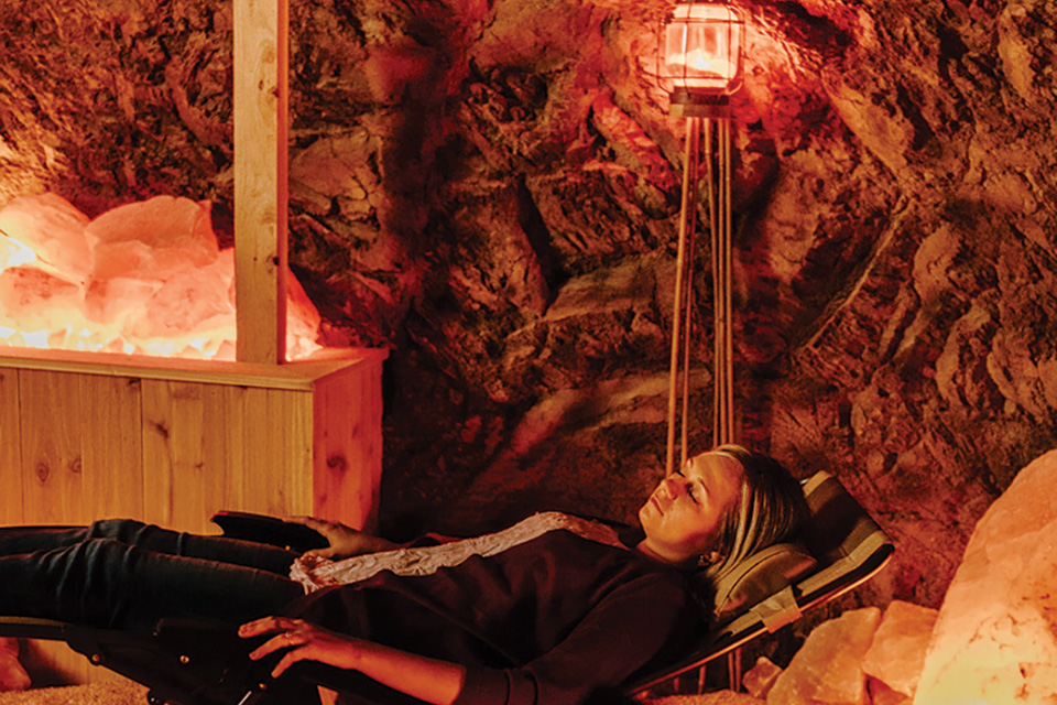 Woman relaxing in Hocking Hills Serenity Cave (photo by Megan Leigh Barnard)