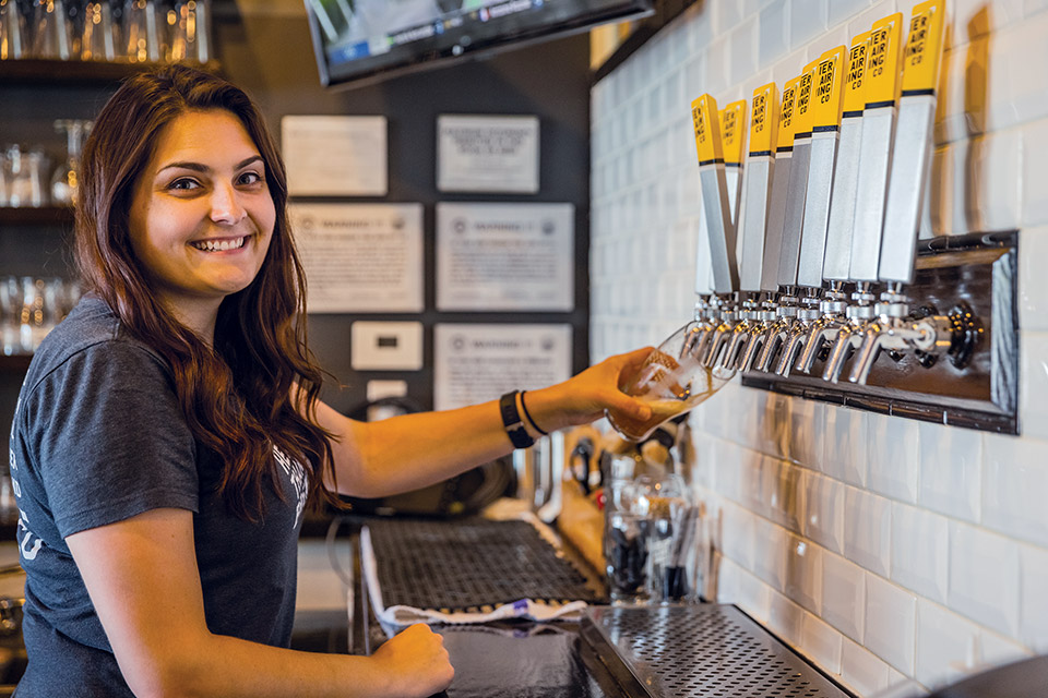 Bartender pours a beer at Heavier Than Air Brewing Co. in Centerville (photo by Matthew Allen)