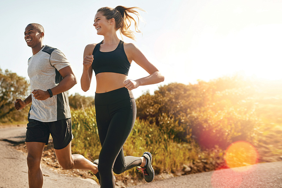 People running together outside (photo by iStock)