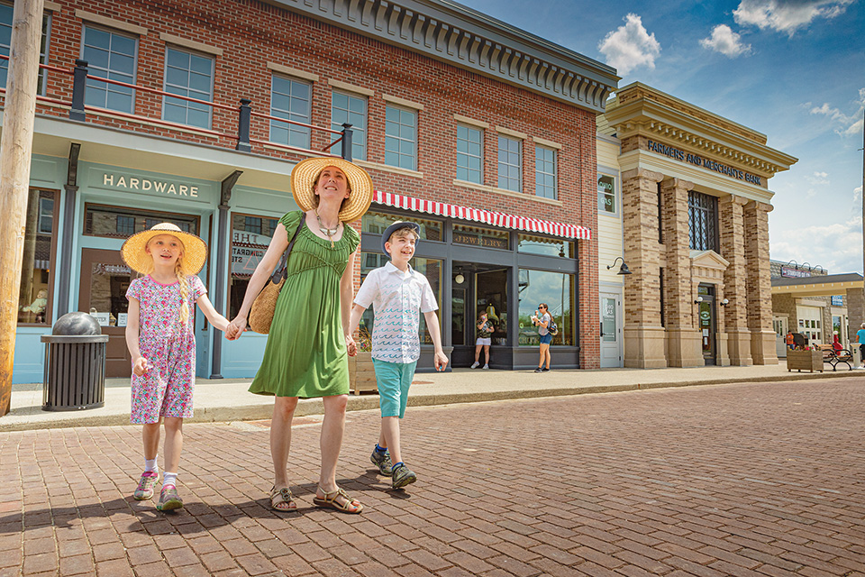 Mom and kids walking in Sauder Village (photo by Laura Watilo Blake)