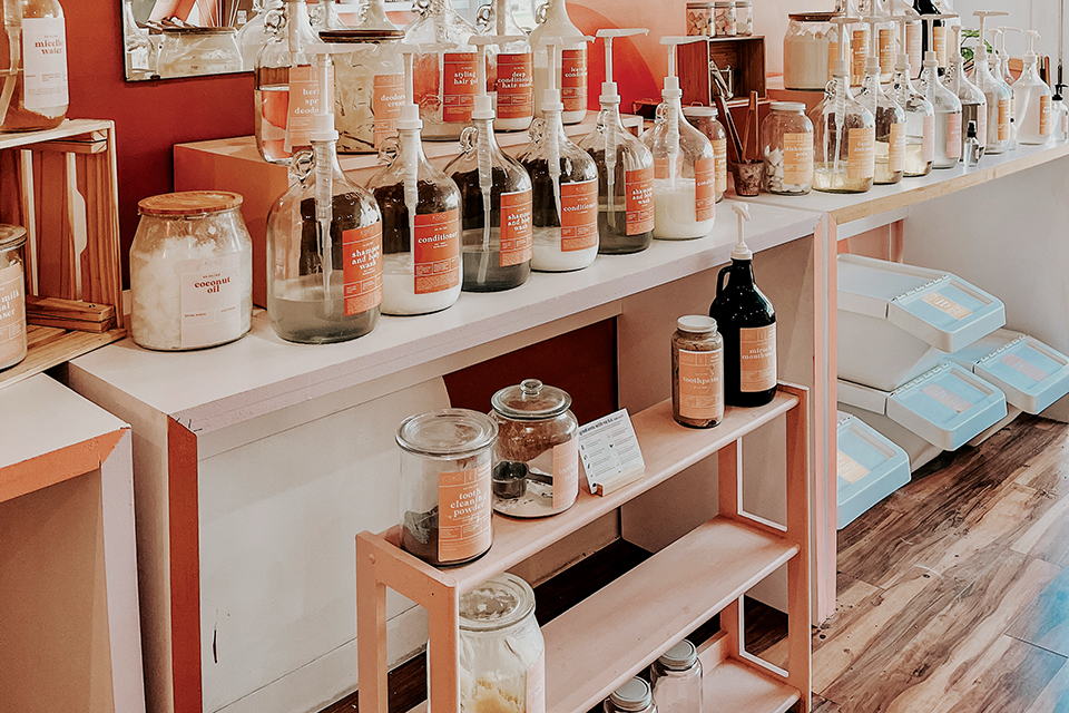 Shelf with shampoo, body wash, coconut oil, toothpaste and more at Columbus’ Koko Sustainable Living Shop + Refillery (photo courtesy of Koko Sustainable Living Shop + Refillery)