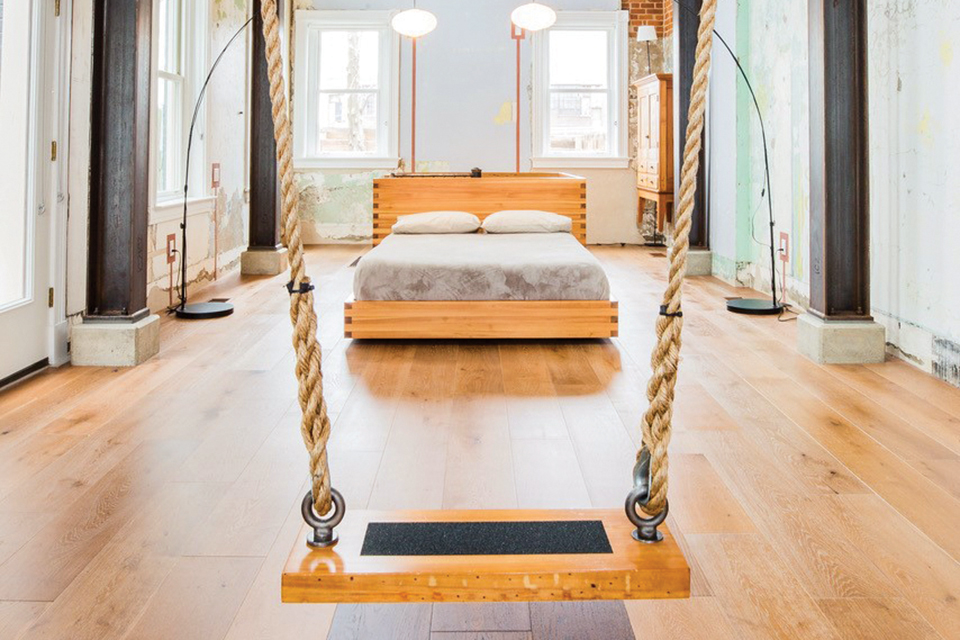 Wooden swing inside Cincinnati’s The Swing House (photo courtesy of Swing House)