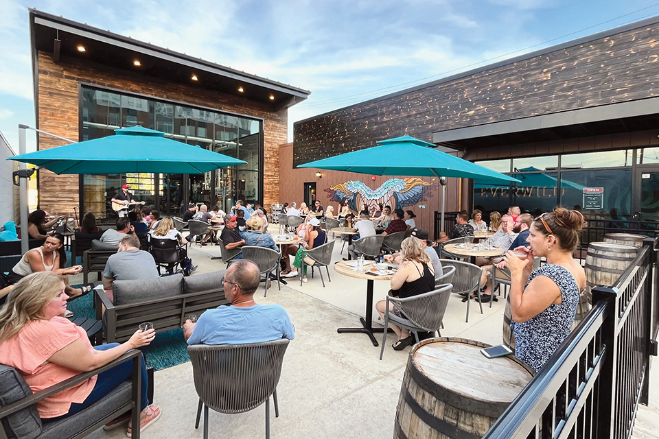 Crowd sitting on outdoor patio at Everwild Spirits in Sandusky (photo courtesy of Everwild Spirits)