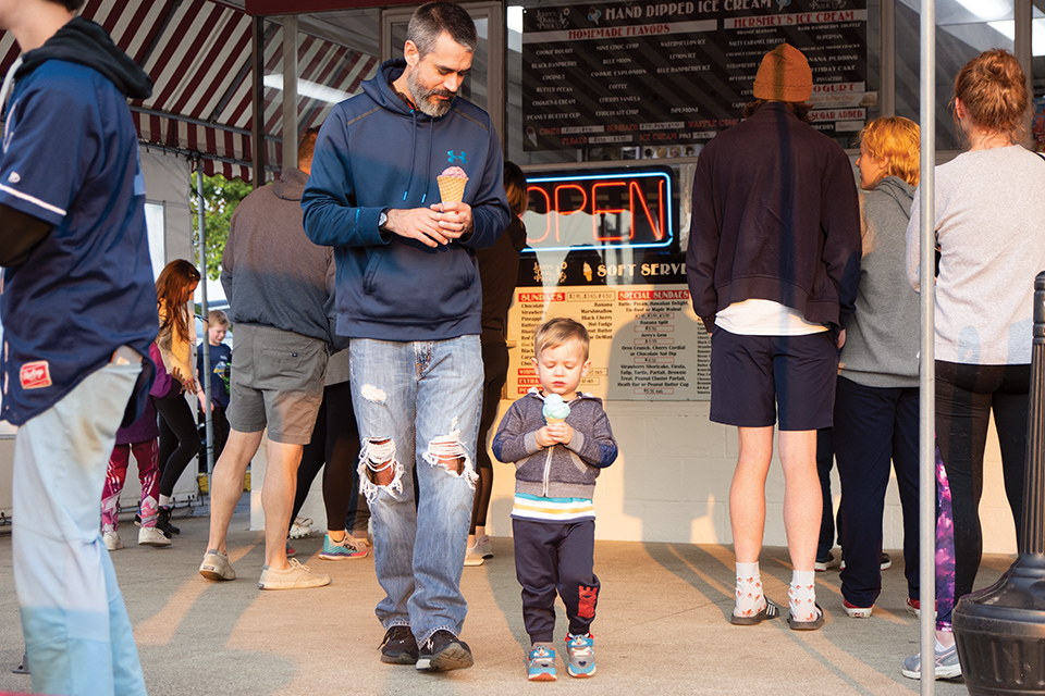 Father and son walking with ice cream cones at Jerry’s Dari-Pride in Wickliffe (photo by Rachael Jirousek)