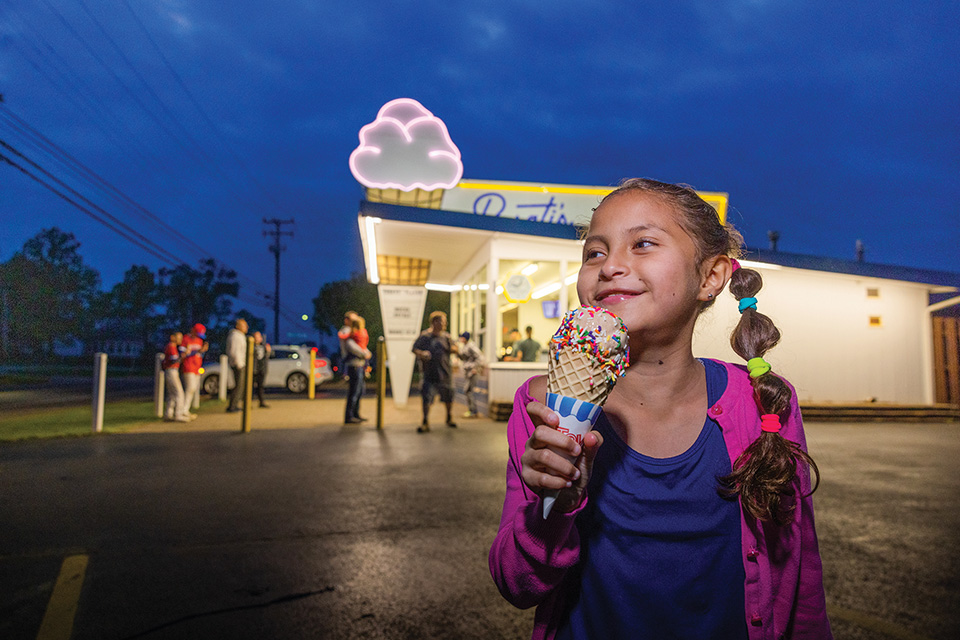 Girl eating ice cream at Rosati’s Frozen Custard in Northfield (photo by Laura Watilo Blake)