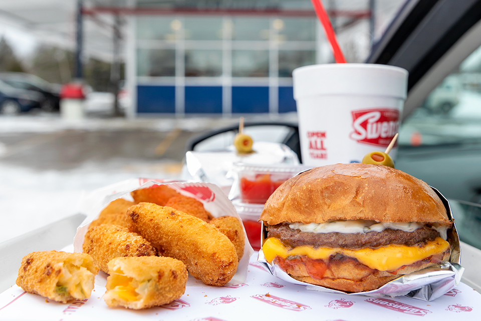 Swenson’s potato teasers, Galley Boy burger and milkshake on drivers’ side door tray (photo by Karin McKenna)