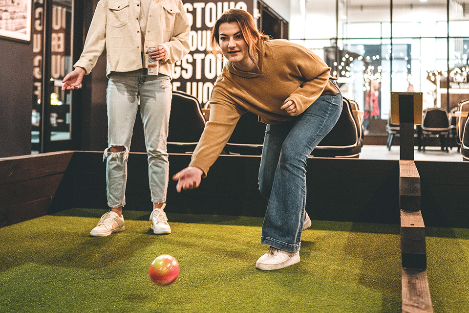 Woman playing indoor game at Steel Valley Brew Works in Boardman (photo by Steel Valley Brew Works / Bentley Photography)