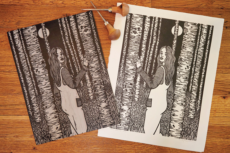 The original carving and the “Come with Me“ print by Emily Cooper Creations (photo by Perry Holser)