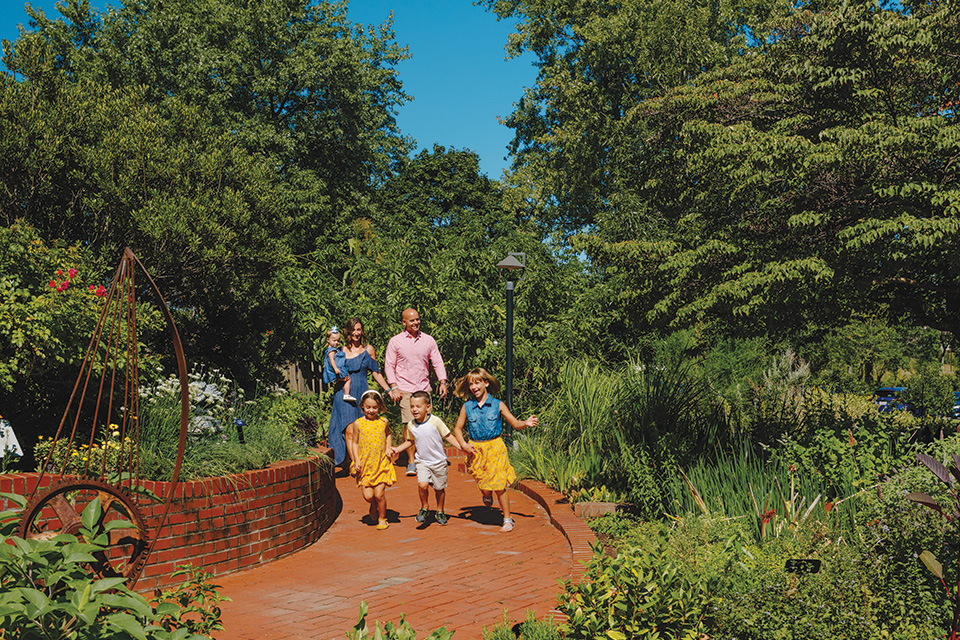 Family walking on path at Grove City’s Gardens at Gantz (photo by Megan Leigh Barnard)