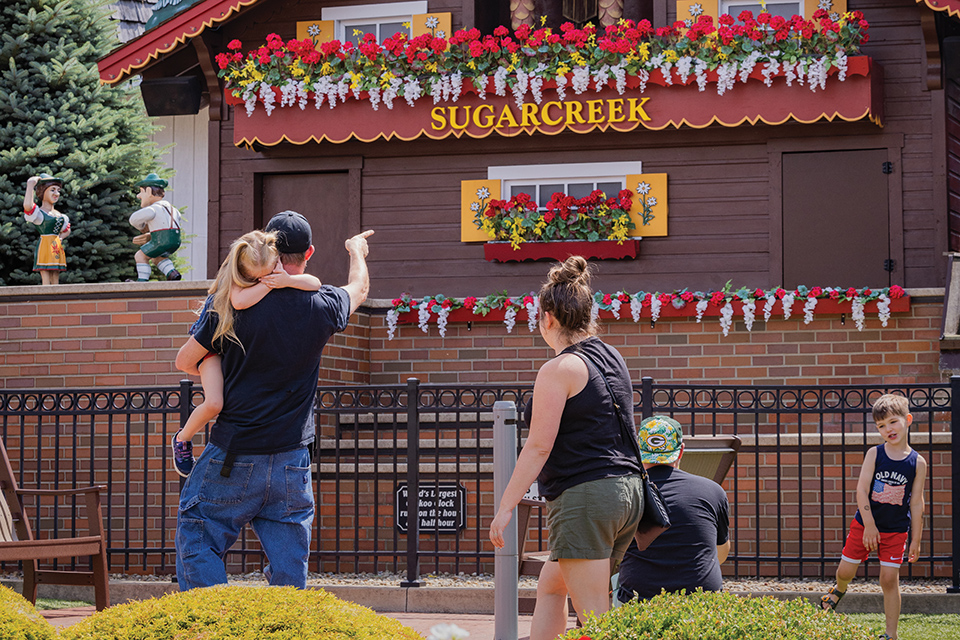 Family looking at Sugarcreek’s giant cuckoo clock (photo by Laura Watilo Blake)