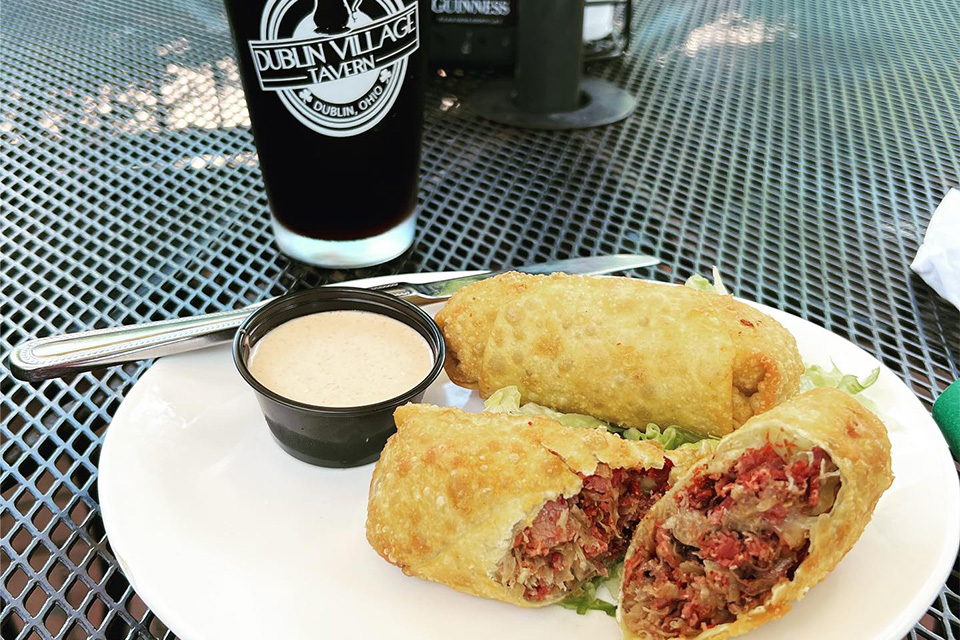 Food and beer on outdoor table at Dublin Village Tavern in Dublin (photo courtesy of Dublin Village Tavern)