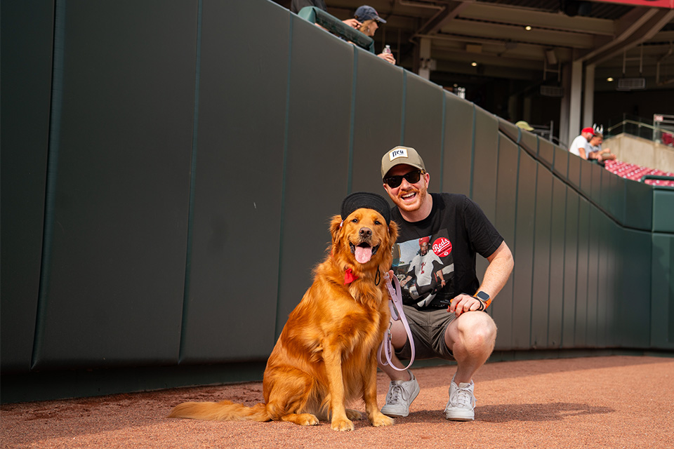 Dog and owner at Bark in the Park with the Cincinnati Reds (photo courtesy of Cincinnati Reds)