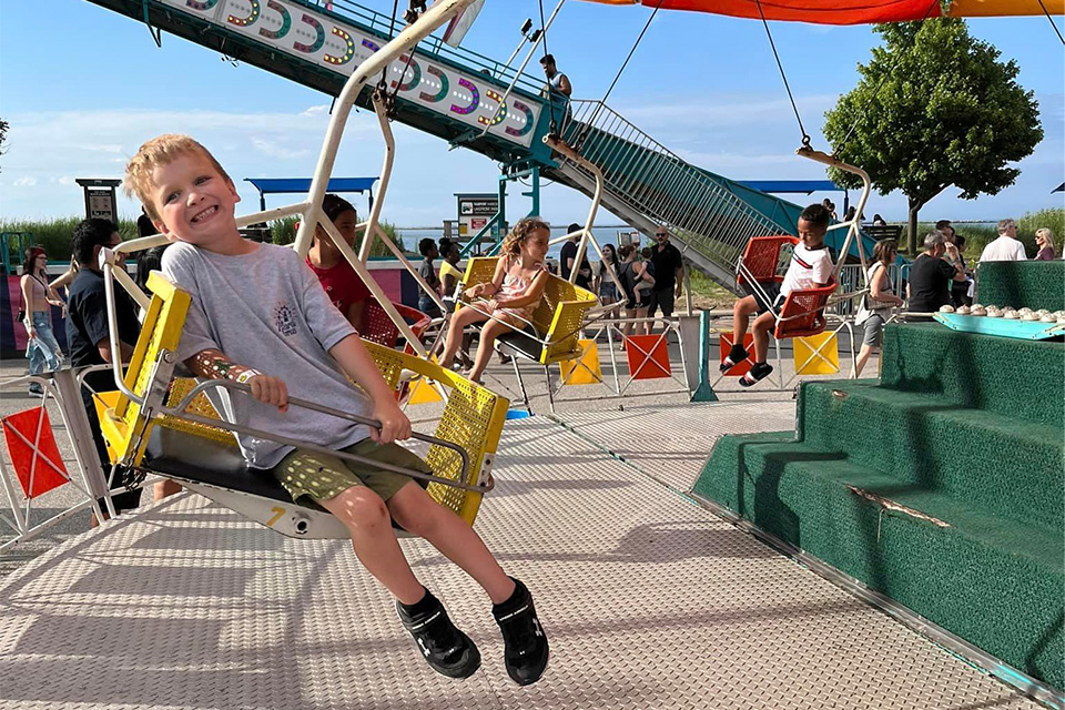 Child on carnival ride at Fairport Mardi Gras (photo courtesy of Fairport Mardi Gras)