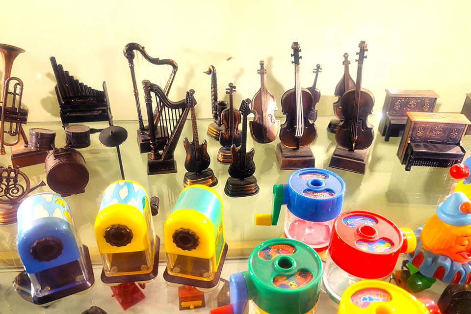 Close-up of pencil sharpeners on a shelf at the Rev. Paul A. Johnson Pencil Sharpener Museum (photo courtesy of Explore Hocking Hills)