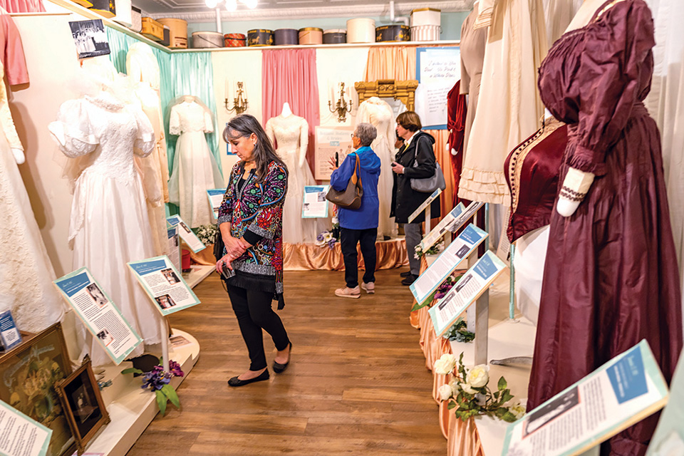 Visitors looking at historical garments at Bowling Green’s Wood County Museum (photo courtesy of Wood County Museum)