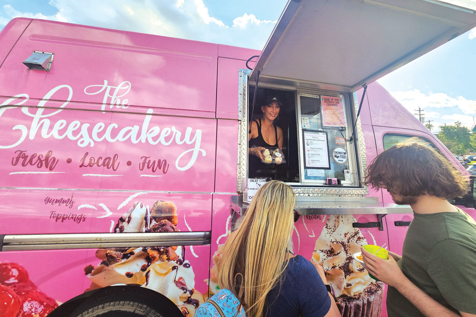 People receiving food at The Cheesecakery food truck in Cincinnati (photo courtesy of The Cheesecakery)