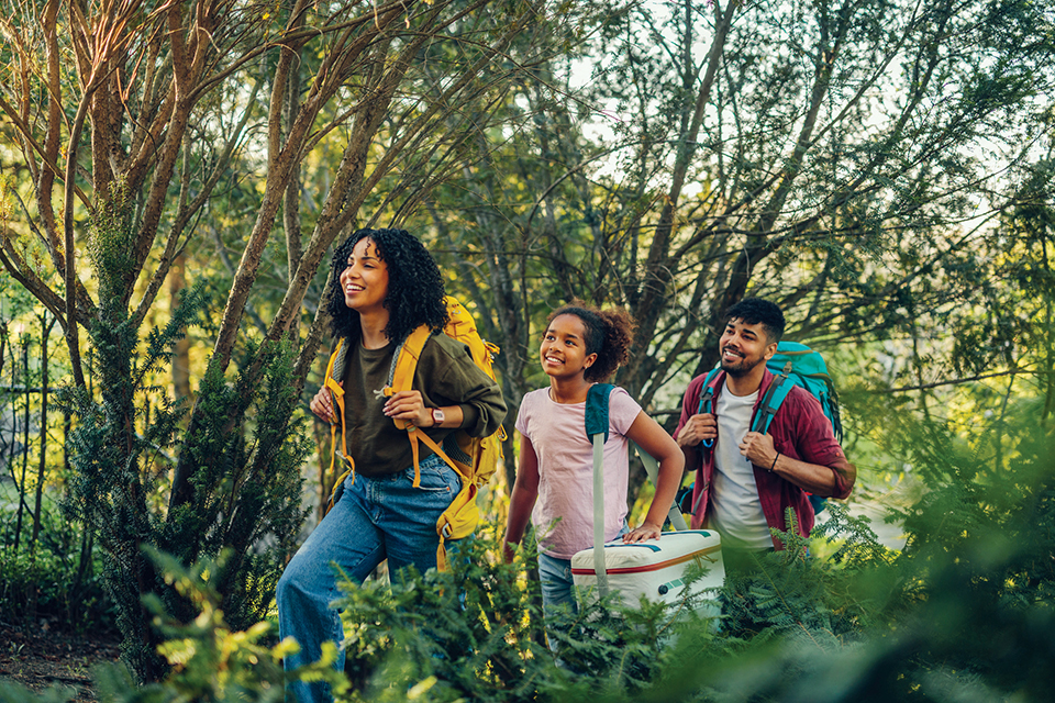 Family hiking in nature (photo by iStock)