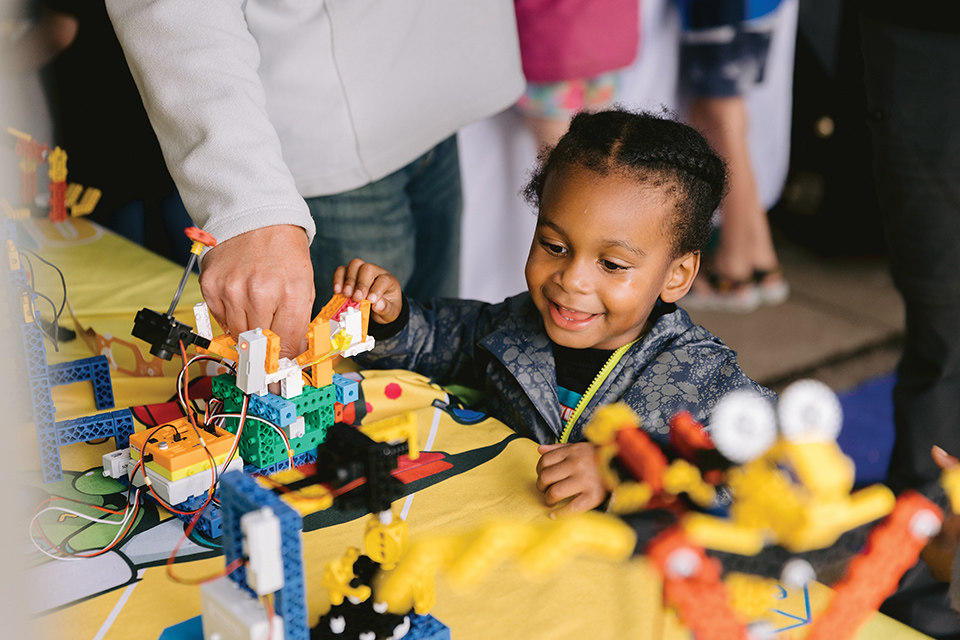 Child playing at COSI Science Festival in Columbus (photo by Alli Mullkin for Robb McCormick Photography)