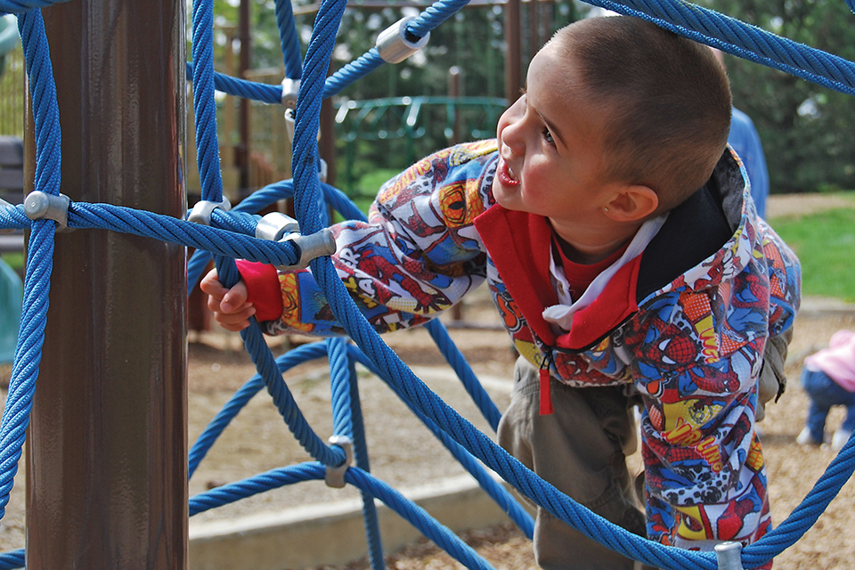 Boy climbing playground equipment at Columbus & Franklin County Metro Park (photo by Leslie Dybiec)