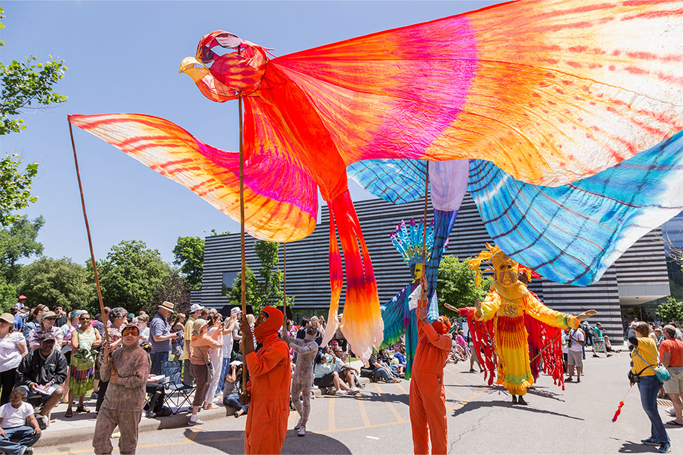 Parade participants holding colorful flags at Parade the Circle in Cleveland (photo courtesy of Cleveland Museum of Art)