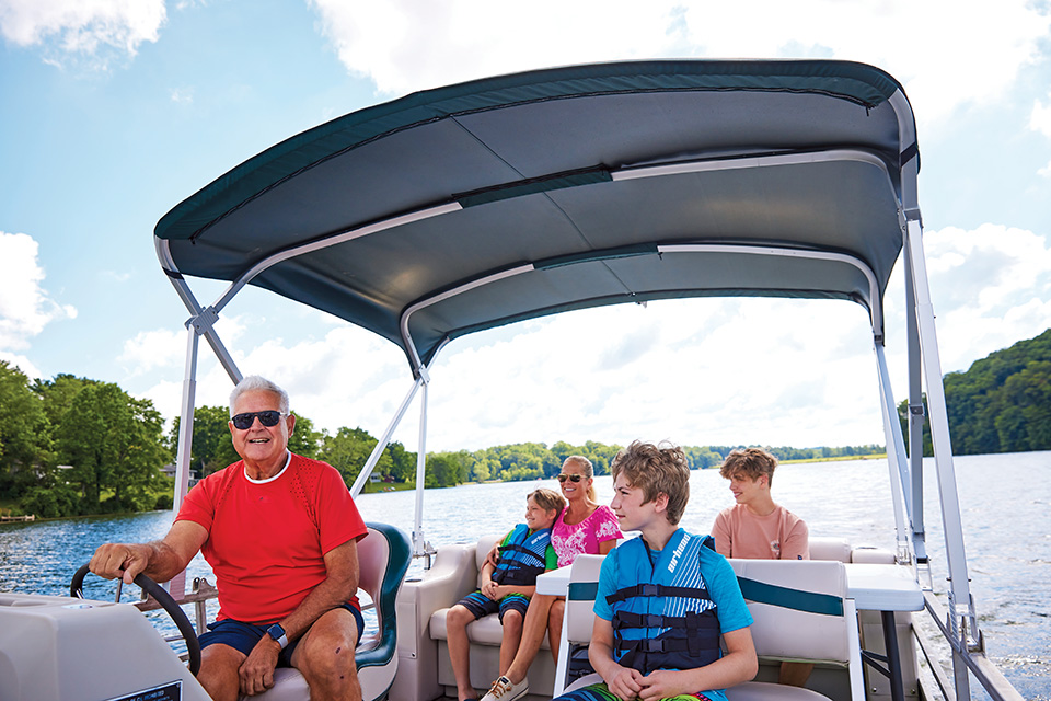 Family on boat at Lake Logan State Park in Logan (photo by Kevin Kopanski)