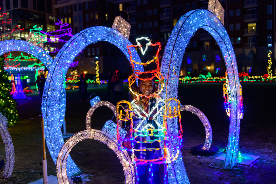 Woman at Columbus Commons Holiday Lights (photo courtesy of Experience Columbus)