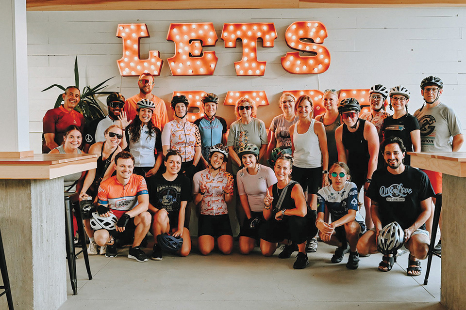 Group of cyclists at OneLove Cafe & Bike Shop in Granville (photo courtesy of OneLove Cafe & Bike Shop)