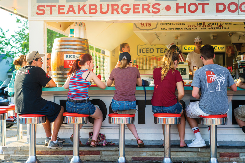 People on barstools at Eddie’s Grill in Geneva-on-the-Lake (photo courtesy of Ashtabula County Visitors Bureau)