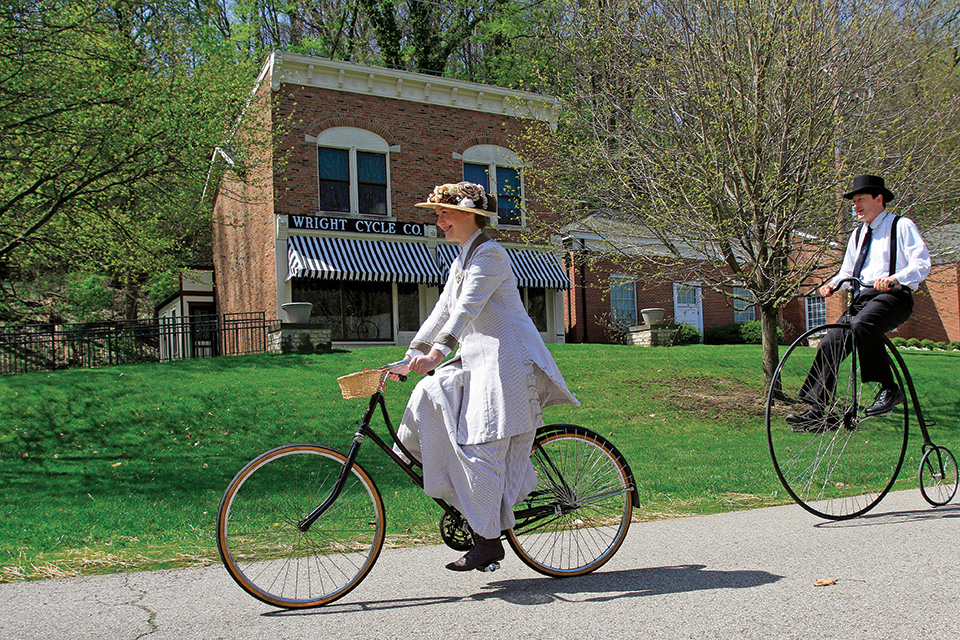 Reenactors biking at Carillon Historical Park in Dayton (photo courtesy of Carillon Historical Park)