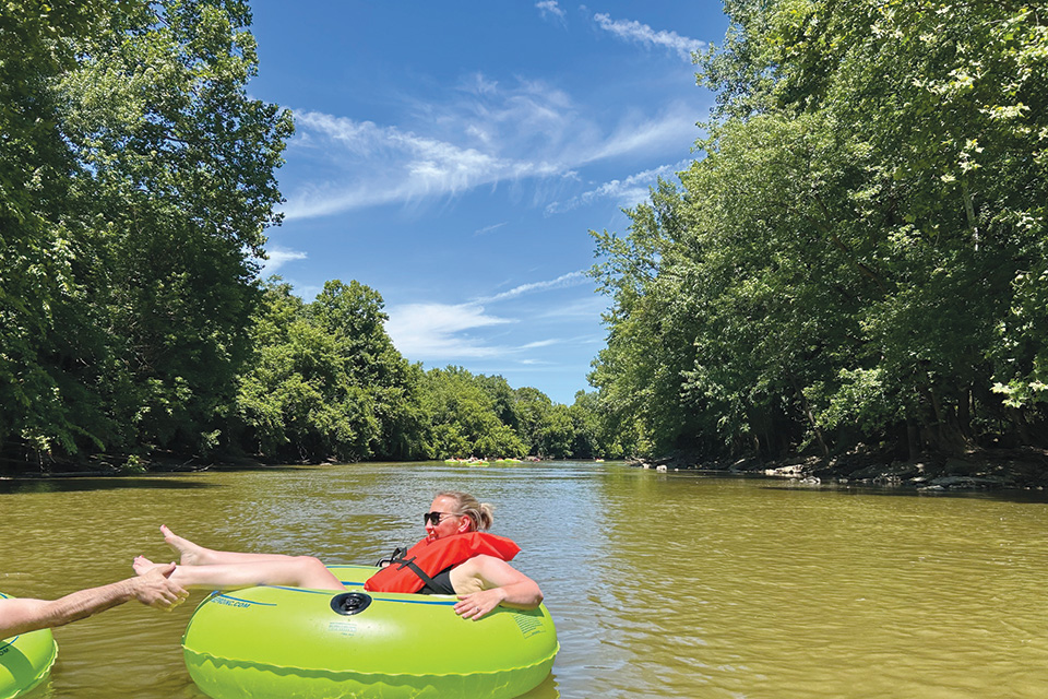 Person on inner tube at Float the River on the Muskingum River (photo courtesy of Zanesville-Muskingum County Convention and Visitors Bureau)