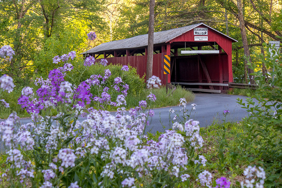 Esther Furnace Covered Brudge with the Covered Bridge Passport in Catawissa, Pennsylvania (photo courtesy of the Columbia-Montour Visitors Bureau)