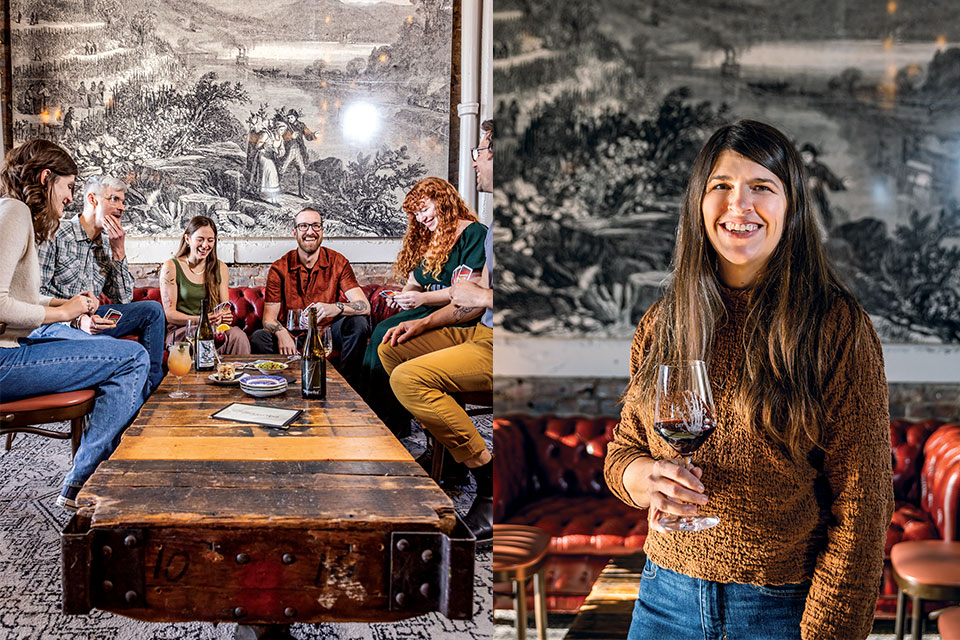 A group laughs around a table with their drinks. Portrait of Kate MacDonald, owner of The Skeleton Root.
