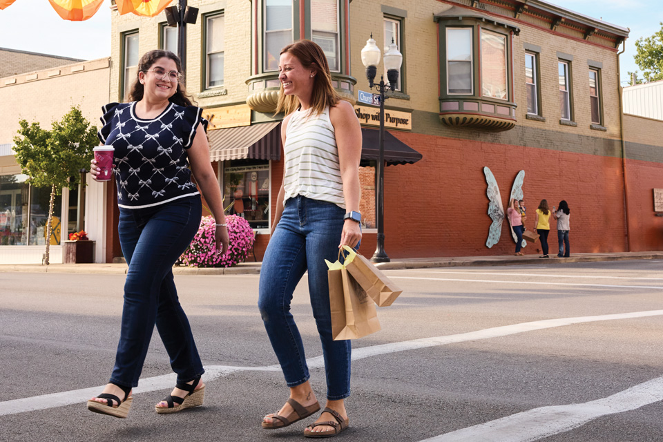 Women walking with shopping bags in downtown Ashland (photo by Kevin Kopanski)