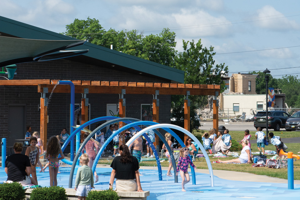 Kids playing in splash pad at Central Park in Green (photo by Rachael Jirousek)
