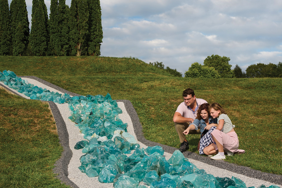 Family looks at the River of Glass feature at Ariel-Foundation Park in Mount Vernon (photo by Brian Kaiser)