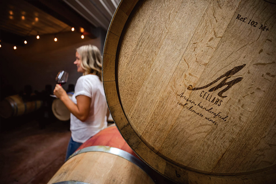 Woman drinking wine at M Cellars in Geneva (photo by Joyhound Photo)