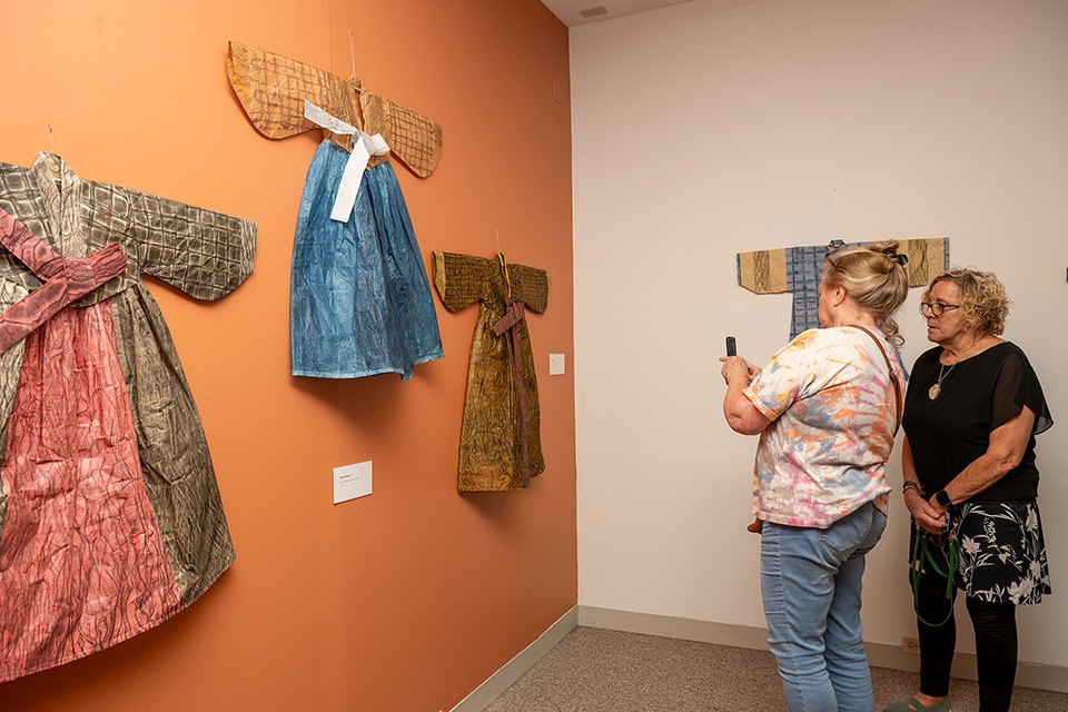 Women looking at “Aimee Lee: Every Last Scrap” exhibit at Kent State University Museum (photo courtesy of Kent State University Museum)