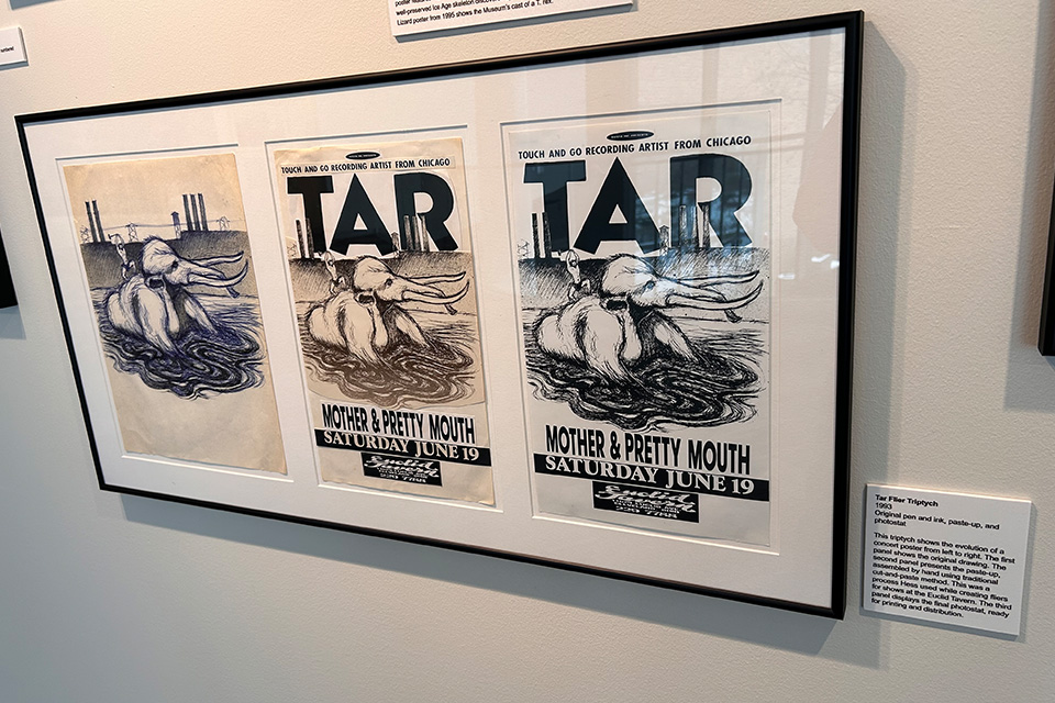 The evolution of Derek Hess’ concert poster for the band Tar is part of the exhibition (photo by Erin Finan)