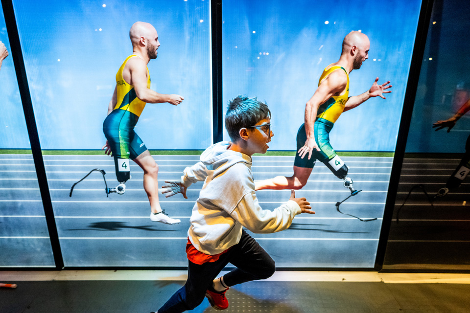 Boy running during “Super Human: Power of Technology” at Great Lake Science Center (photo by Ken Blaze)