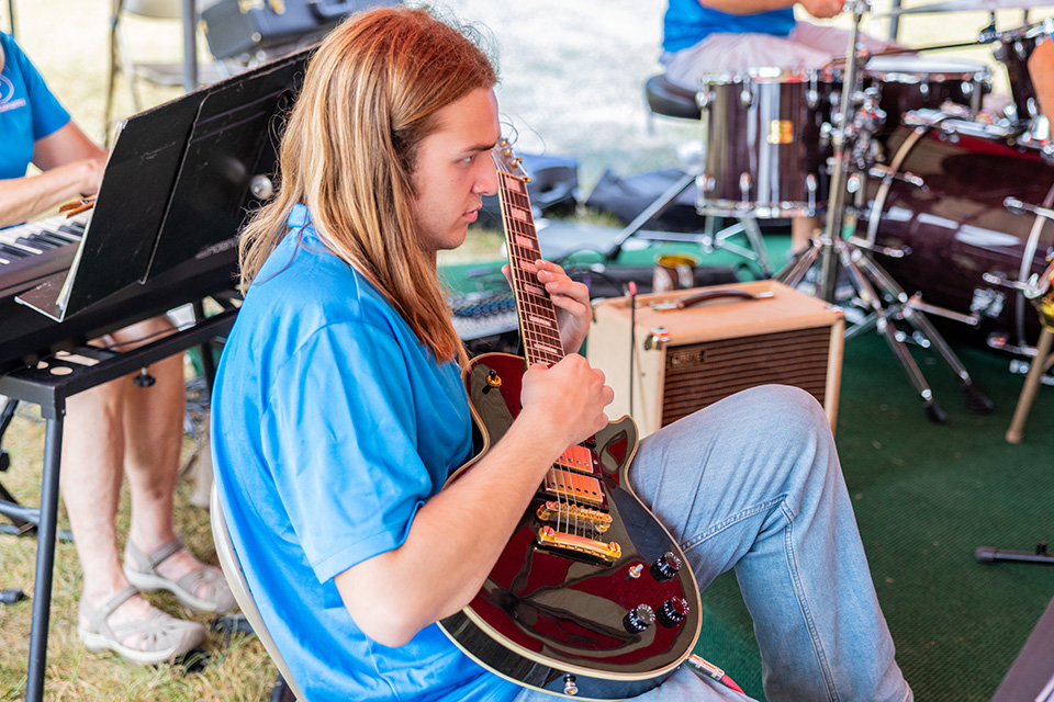 Man playing guitar at Fall Festival at Indian Lake State Park in Lakeview (photo courtesy of Ohio Department of Natural Resources)